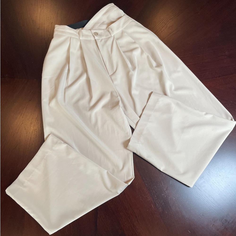 Cream colored crisscross top pants.